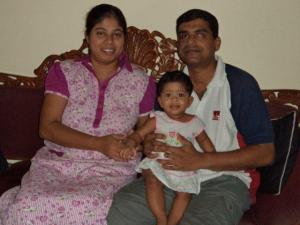 Yenuli with her parents at 7th month