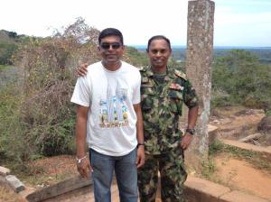 With colonel senadeera in the background of Pulmoddai Sea